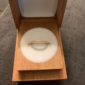 New, unused rose gold (14k) ring size 4 3/4 - half eternity ring